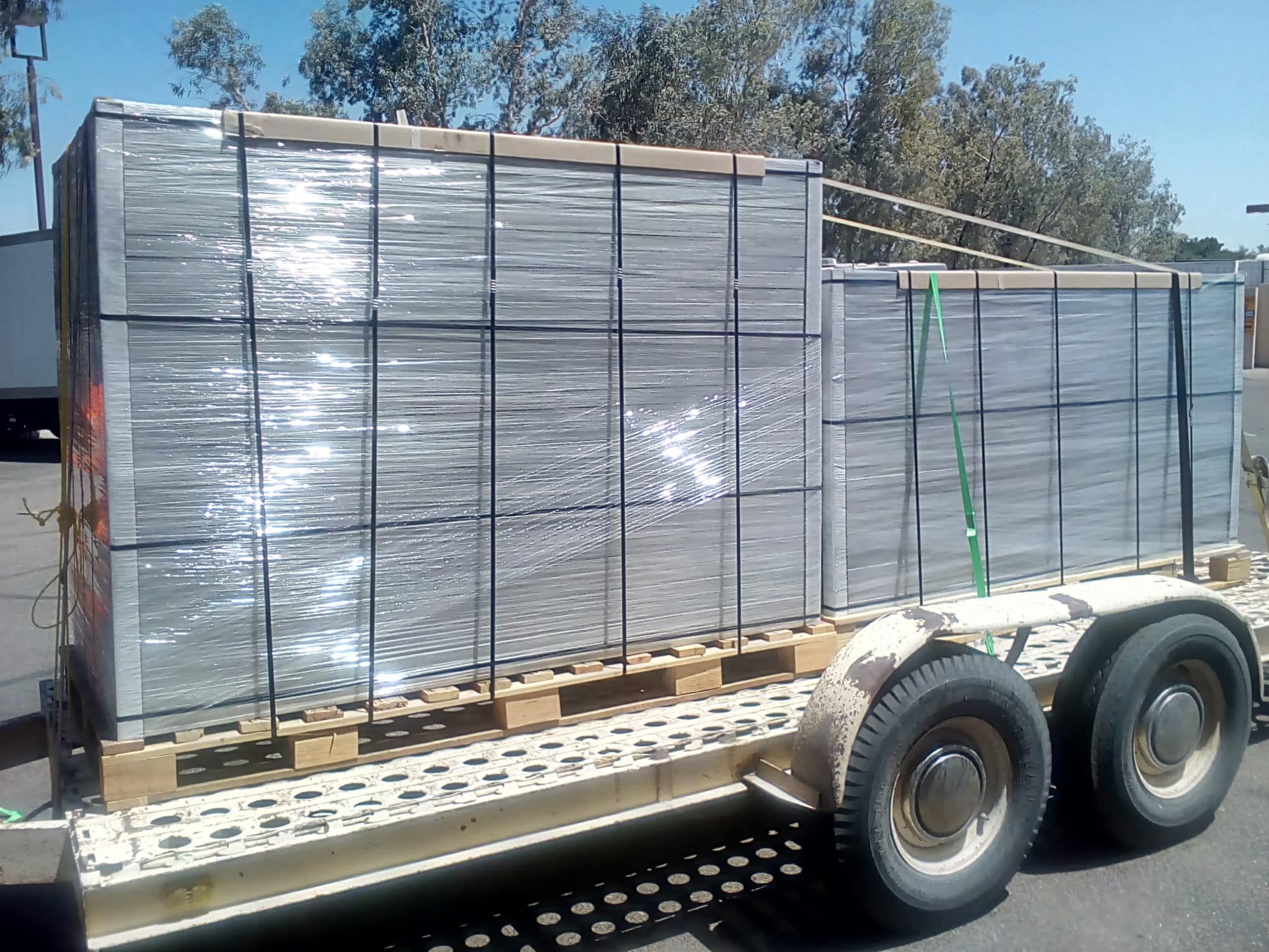Close up large load of solar panels on trailer