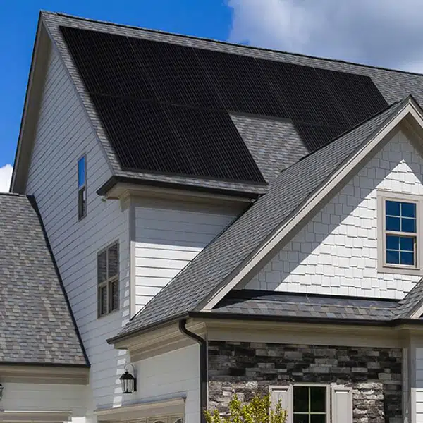 black solar panels on a really slanted roof of a house